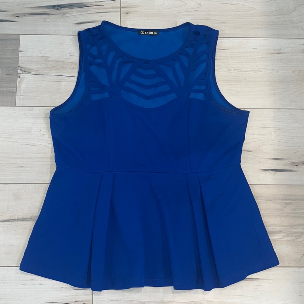 Cut out pleated peplum top